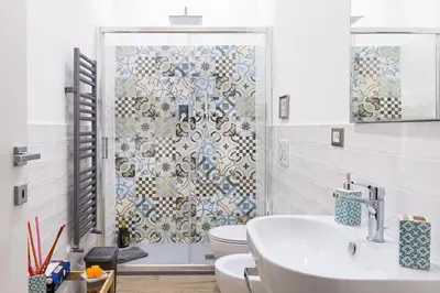 a bathroom with a toilet and a sink and a shower at Sixty One Luxury Room in Rome