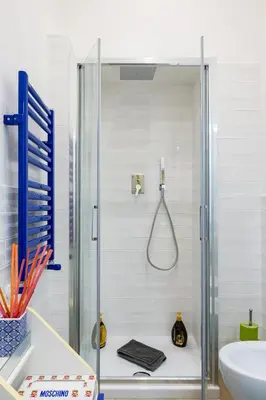 a shower stall in a bathroom with a sink at Sixty One Luxury Room in Rome
