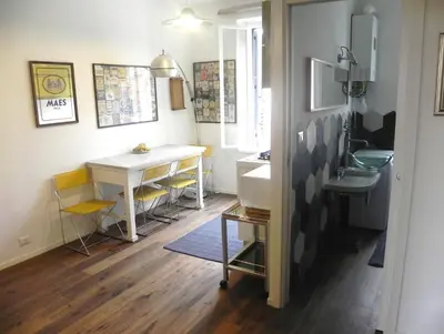 a bathroom with a sink and a desk at LINE-UP Apartment in Rome