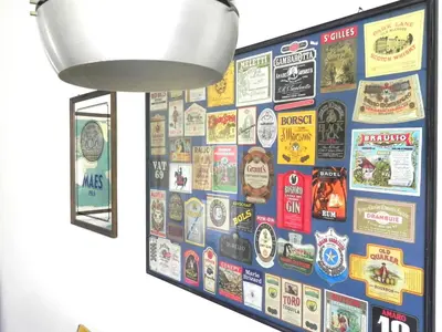 a wall of stickers on a wall in a room at LINE-UP Apartment in Rome