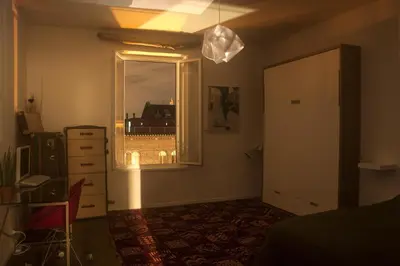 a room with a window and a dresser and a bedroom at LINE-UP Apartment in Rome