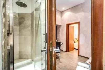 a bathroom with a shower and a glass door at La Residenza Dell'Angelo in Rome