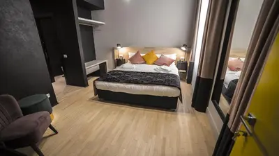 a bedroom with a bed with pillows on it at SuiteLifeTrevi in Rome