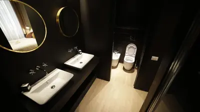 a bathroom with a sink and a mirror and a toilet at SuiteLifeTrevi in Rome
