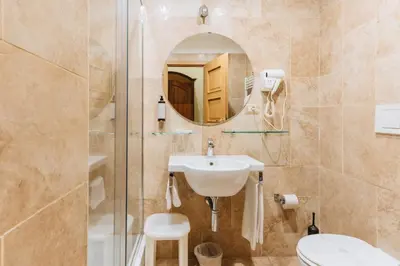 a bathroom with a sink and a shower at Le Clarisse Pantheon in Rome