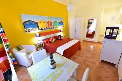 a bedroom with a bed and a table in a room at QuodLibet in Rome