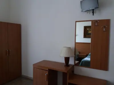 a bedroom with a mirror and a bed and a lamp at Ritmo Blues Guest House in Rome