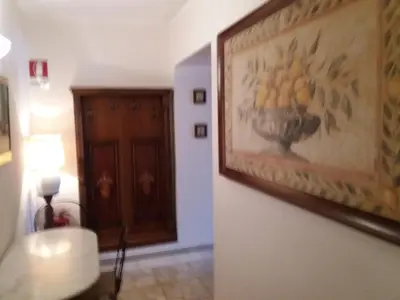 a hallway with a painting of a bowl of lemons at Ritmo Blues Guest House in Rome