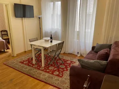 a living room with a table and a couch at Foro Romano Apartments B in Rome