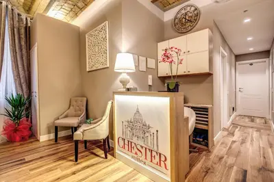 a living room with a sign that reads christ redeemer at Chester Suites in Rome