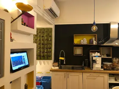 a kitchen with a counter with a computer on it at DAB Guest House in Rome