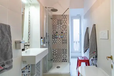 a bathroom with a shower and a sink at DAB Guest House in Rome