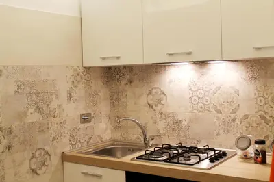 a kitchen with a sink and a stove at Campani Luxury Flat in Rome