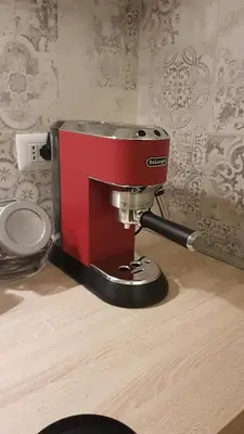 a red coffee maker sitting on top of a table at Campani Luxury Flat in Rome