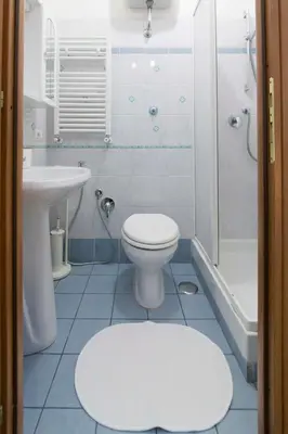 a bathroom with a toilet and a sink and a shower at Albachiara Guest House in Rome