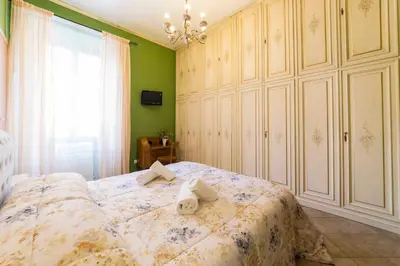 a bedroom with a bed with two towels on it at Albachiara Guest House in Rome