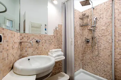 a bathroom with a sink and a shower at Imperial Loft in Rome