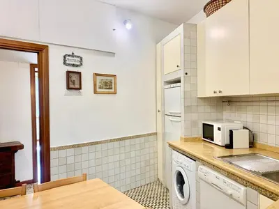 a kitchen with a washer and dryer and a microwave at DaliTourism - Vatican Apartment 9 in Rome