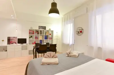 a bedroom with a bed with two towels on it at iFlat Via Veneto Design Studio in Rome