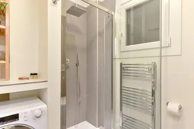 a shower with a glass door in a bathroom at iFlat Via Veneto Design Studio in Rome