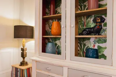 a hutch with vases in it with a dog in it at Casa Fabbrini Fancy Suites in Rome