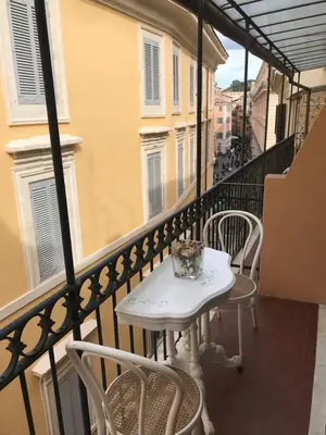 a white table and chairs on a balcony at Rome dreaming house in Rome