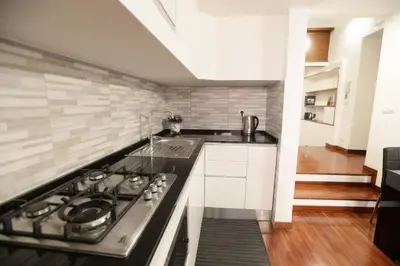 a kitchen with a stove and a sink at Home Alex in Rome