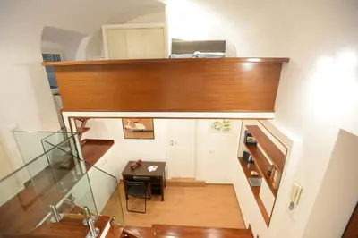 an overhead view of a room with a desk and a table at Home Alex in Rome