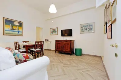 a living room with a couch and a table at Sistina 2 in Rome