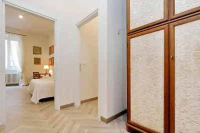 a bedroom with a bed and a sliding glass door at Sistina 2 in Rome