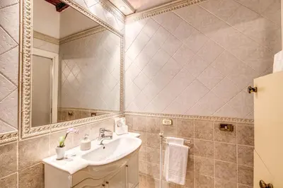 a bathroom with a sink and a mirror at FRESH HOUSE TREVI 1 in Rome