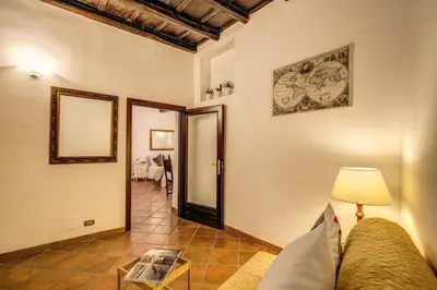 a living room with a couch and a table at FRESH HOUSE TREVI 1 in Rome