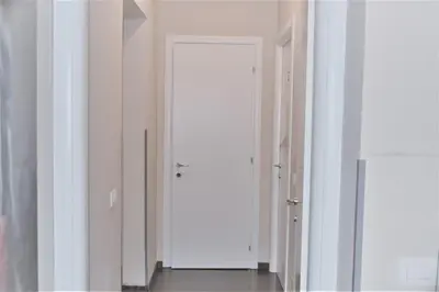 a hallway with white doors in a room at Art And Relax Suites in Rome