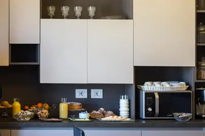 a kitchen with a counter top with a microwave at Top Floor Trastevere in Rome