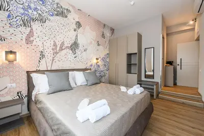 a bedroom with a bed with two white towels on it at Castro Pretorio in Rome