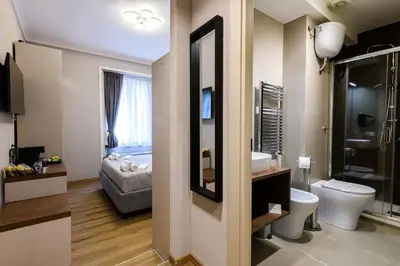 a bathroom with a toilet and a sink at Castro Pretorio in Rome