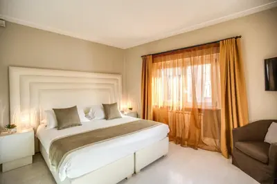 a bedroom with a large bed and a window at Gonfalone 6 in Rome
