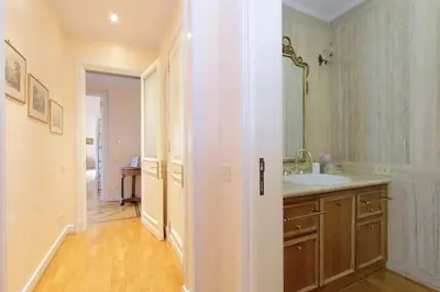a bathroom with a sink and a mirror at Vatican House Via Terenzio in Rome