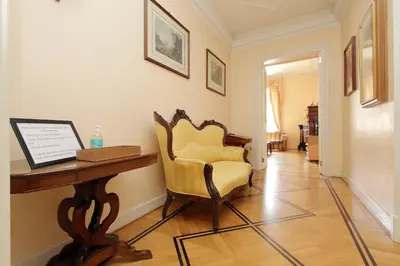 a living room with a desk and a chair at Vatican House Via Terenzio in Rome