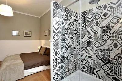 a bedroom with a bed and a glass wall at romantica guest house in Rome