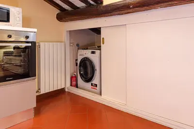 a laundry room with a washer and dryer at Luxury Apartment Pantheon in Rome