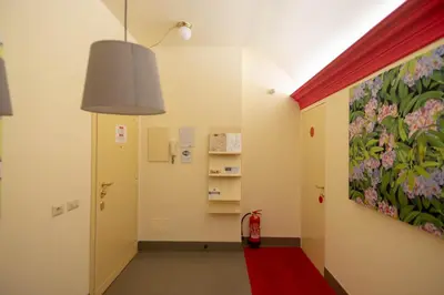 a hallway with a painting of flowers on the wall at tiaspettoaroma in Rome