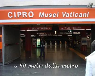 a man walking in front of a shopping mall at Vatican Meloria House in Rome