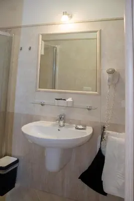 a bathroom with a sink and a mirror at Domus Diana in Rome