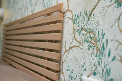 a pillow with a floral pattern on a wall at Domus Diana in Rome