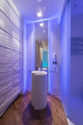 a bathroom with a white tub and a sink at LUX Suites in Roma in Rome