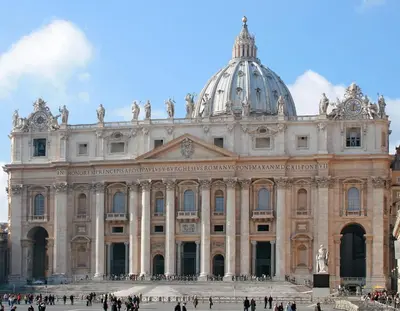 a large building with people walking in front of it at Vatican Area House in Rome