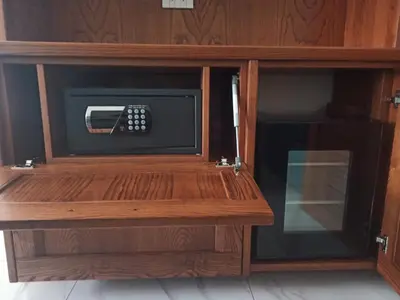 a microwave oven in a wooden cabinet at B&B Alle mura di San Giovanni in Rome