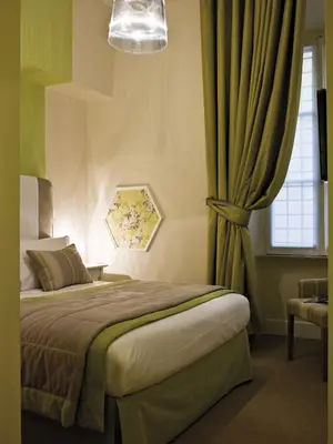 a bedroom with a bed and a window at Le Stanze Di Orazio in Rome