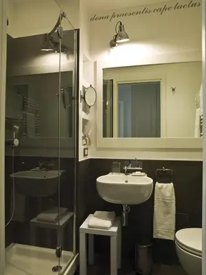 a bathroom with a sink and a mirror at Le Stanze Di Orazio in Rome